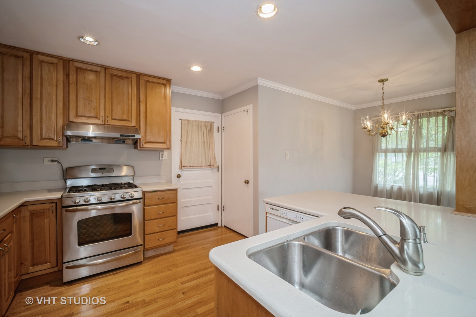 1126 Whitfield Road Northbrook, IL 60062 - Photo 6 of 14 a kitchen with a sink stove and cabinets
