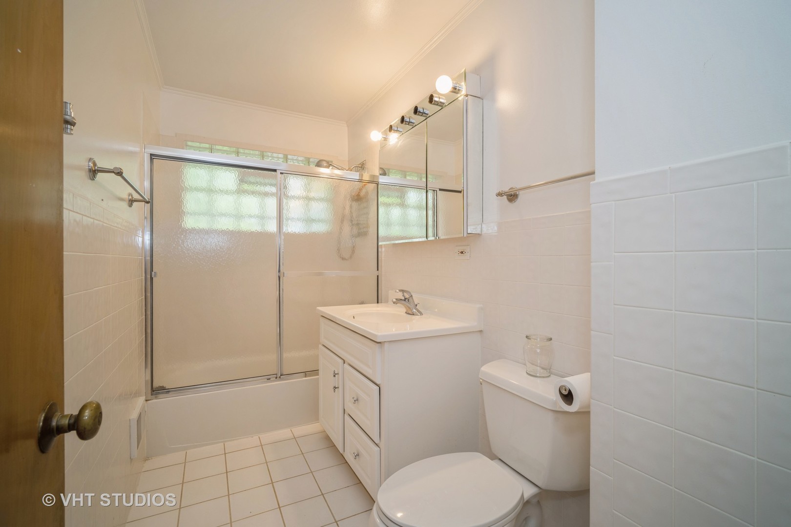 1126 Whitfield Road Northbrook, IL 60062 - Photo 8 of 14 a bathroom with a sink toilet and shower