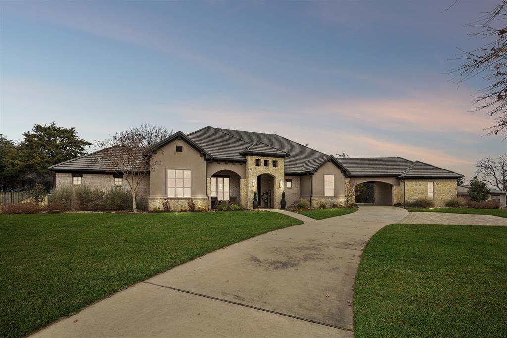 1641 Knox Road Keller, TX 76262 - Photo 1 of 40 a front view of a house with a yard and garage