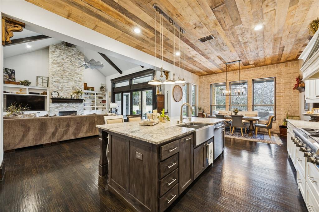 1641 Knox Road Keller, TX 76262 - Photo 12 of 40 a kitchen with stainless steel appliances granite countertop lots of counter top and view of the living room