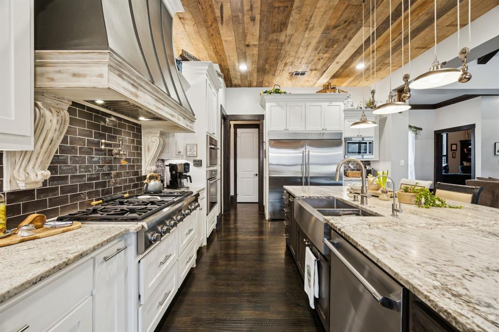 1641 Knox Road Keller, TX 76262 - Photo 13 of 40 a kitchen with stainless steel appliances granite countertop a sink and a stove