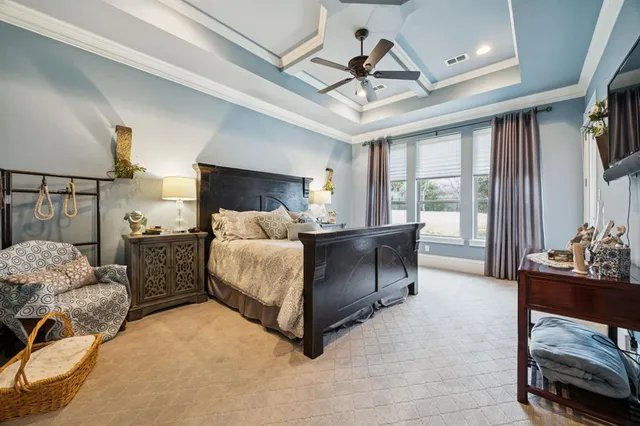a bedroom with furniture and a chandelier
