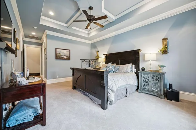 a bed room with a bed and a chair