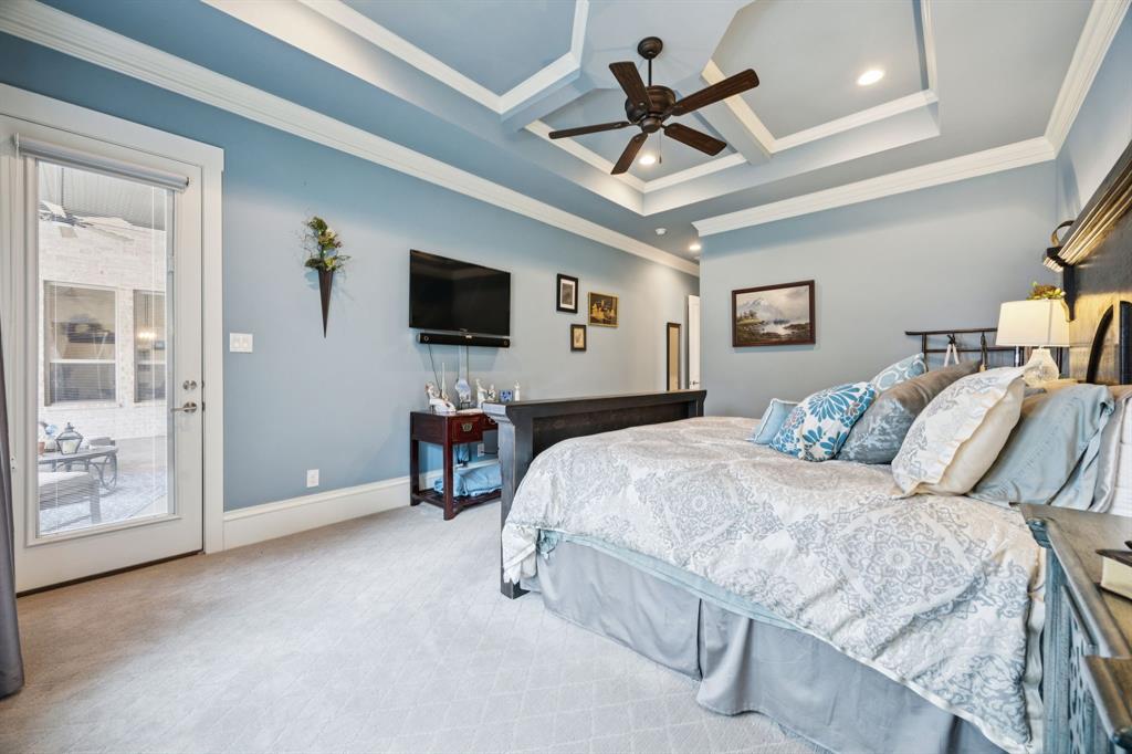 1641 Knox Road Keller, TX 76262 - Photo 20 of 40 a bedroom with a large bed and a flat screen tv