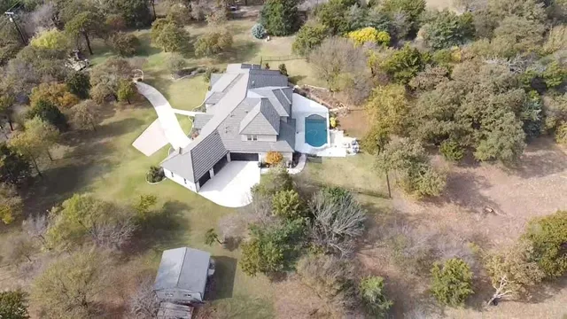 an aerial view of residential house with outdoor space