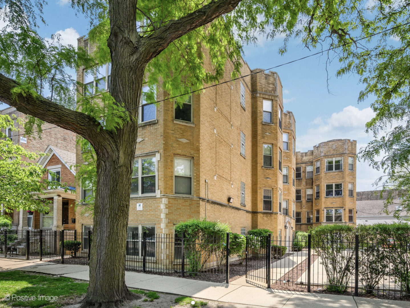 3017 West George Street, Unit 2B Chicago, IL 60618 - Photo 1 of 1 a view of a building with a tree