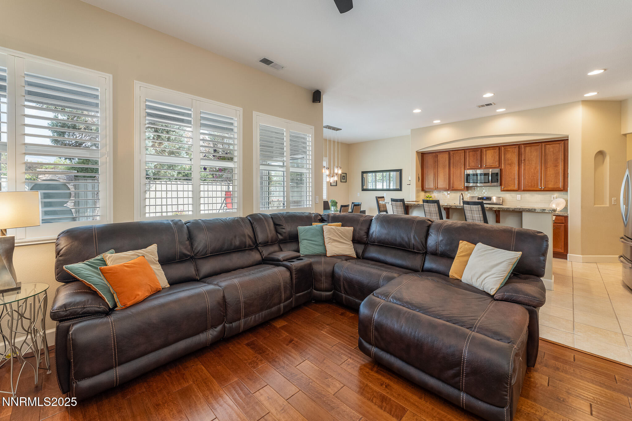 10600 Blue Moon Court Reno, NV 89521 - Photo 11 of 36 a living room with a couches and kitchen view with wooden floor
