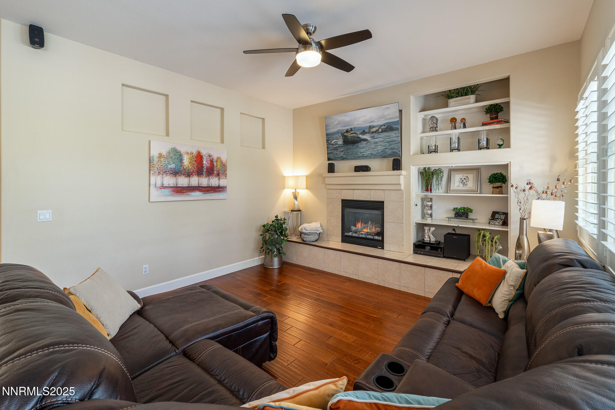 10600 Blue Moon Court Reno, NV 89521 - Photo 12 of 36 a living room with furniture flat screen tv and a fireplace