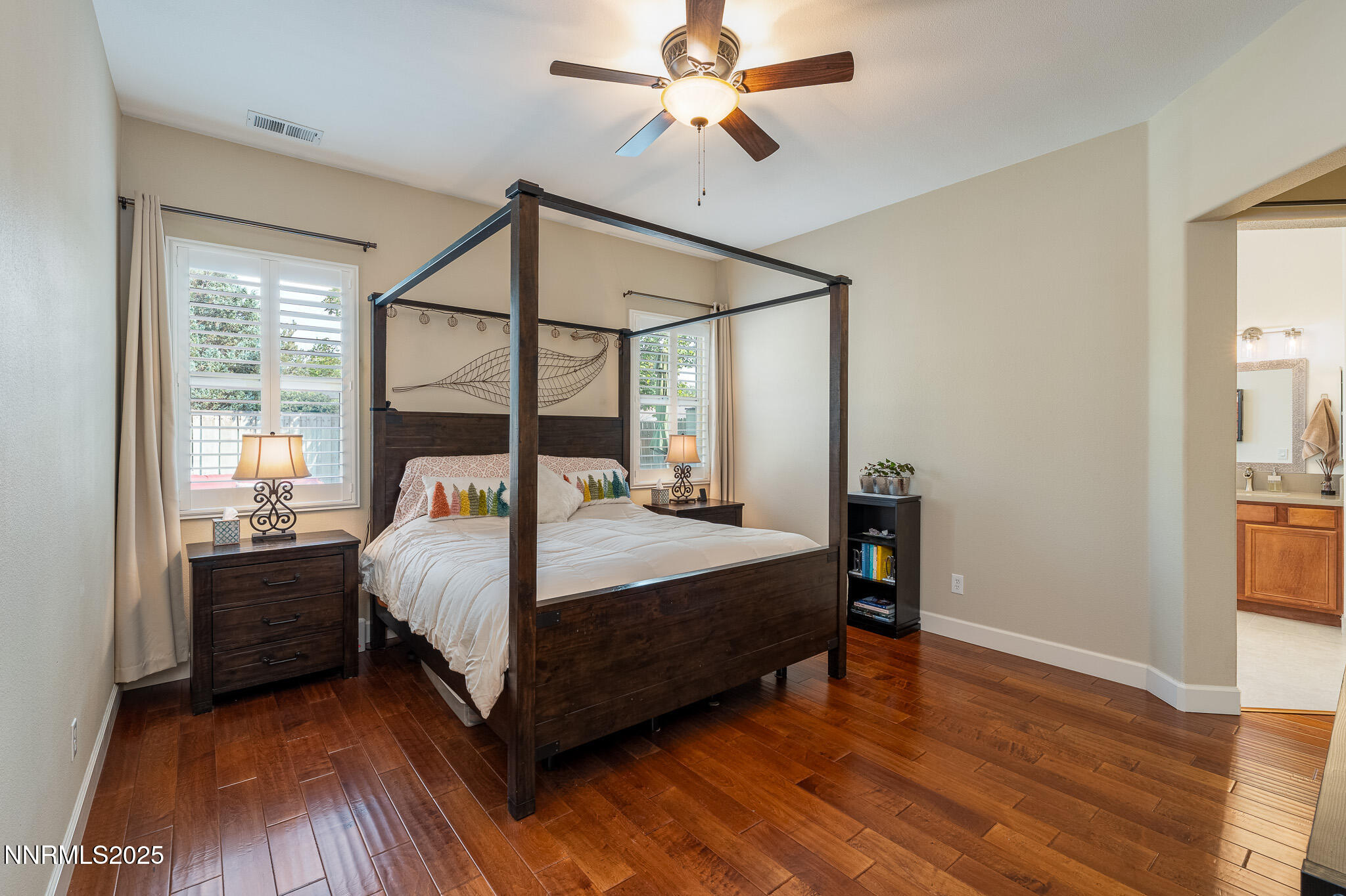 10600 Blue Moon Court Reno, NV 89521 - Photo 14 of 36 a bedroom with a bed and wooden floor