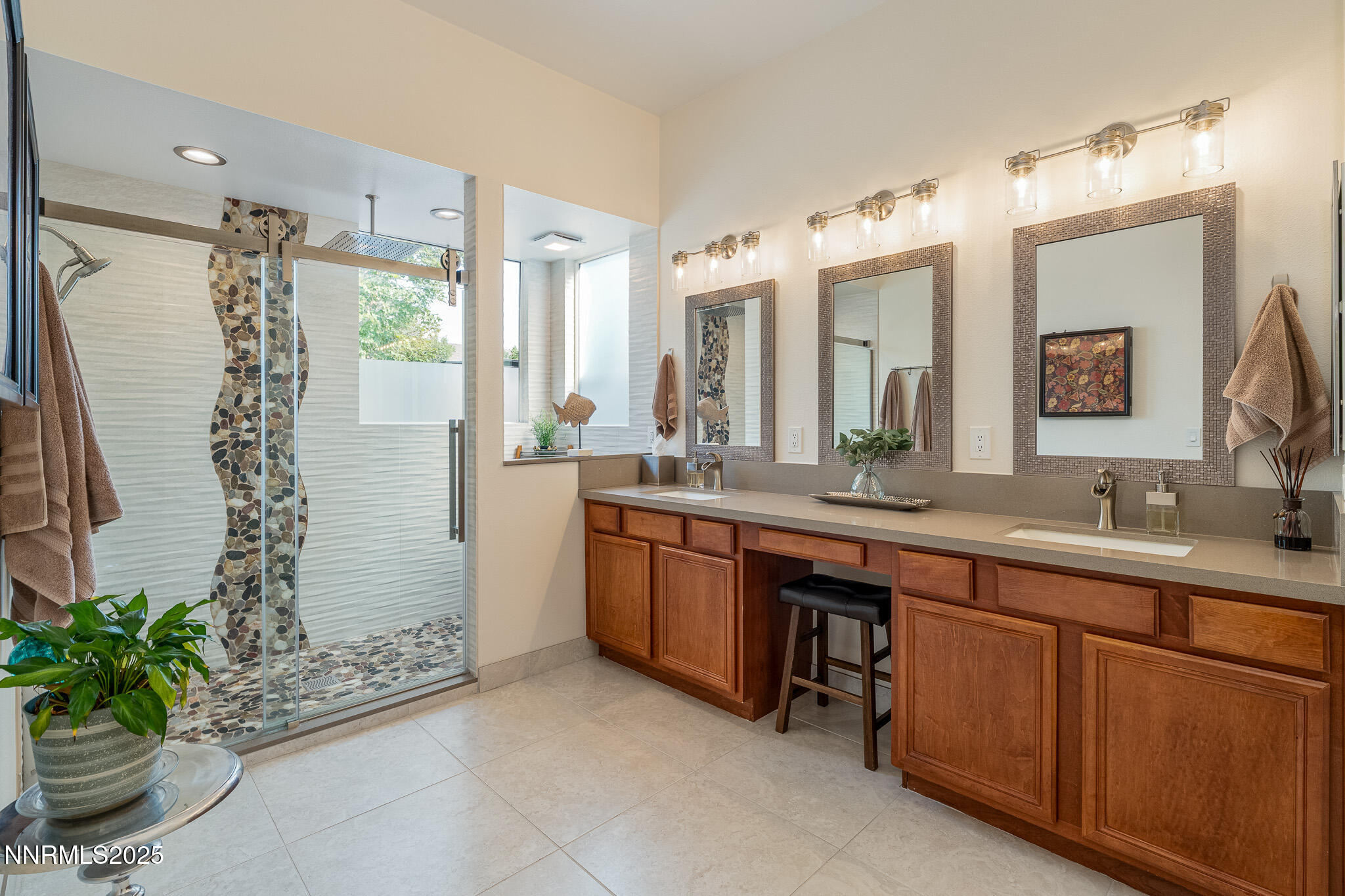 10600 Blue Moon Court Reno, NV 89521 - Photo 16 of 36 a spacious bathroom with a double vanity sink mirror and shower