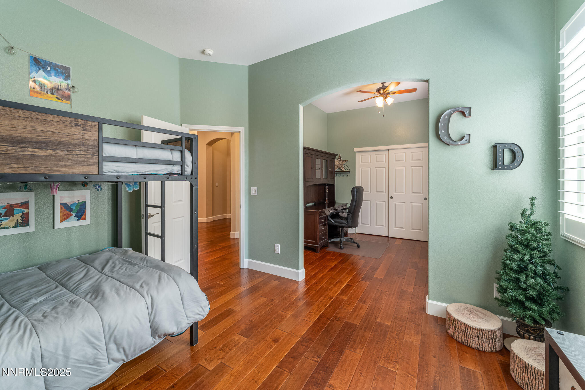 10600 Blue Moon Court Reno, NV 89521 - Photo 19 of 36 a bedroom with a bed and a potted plant