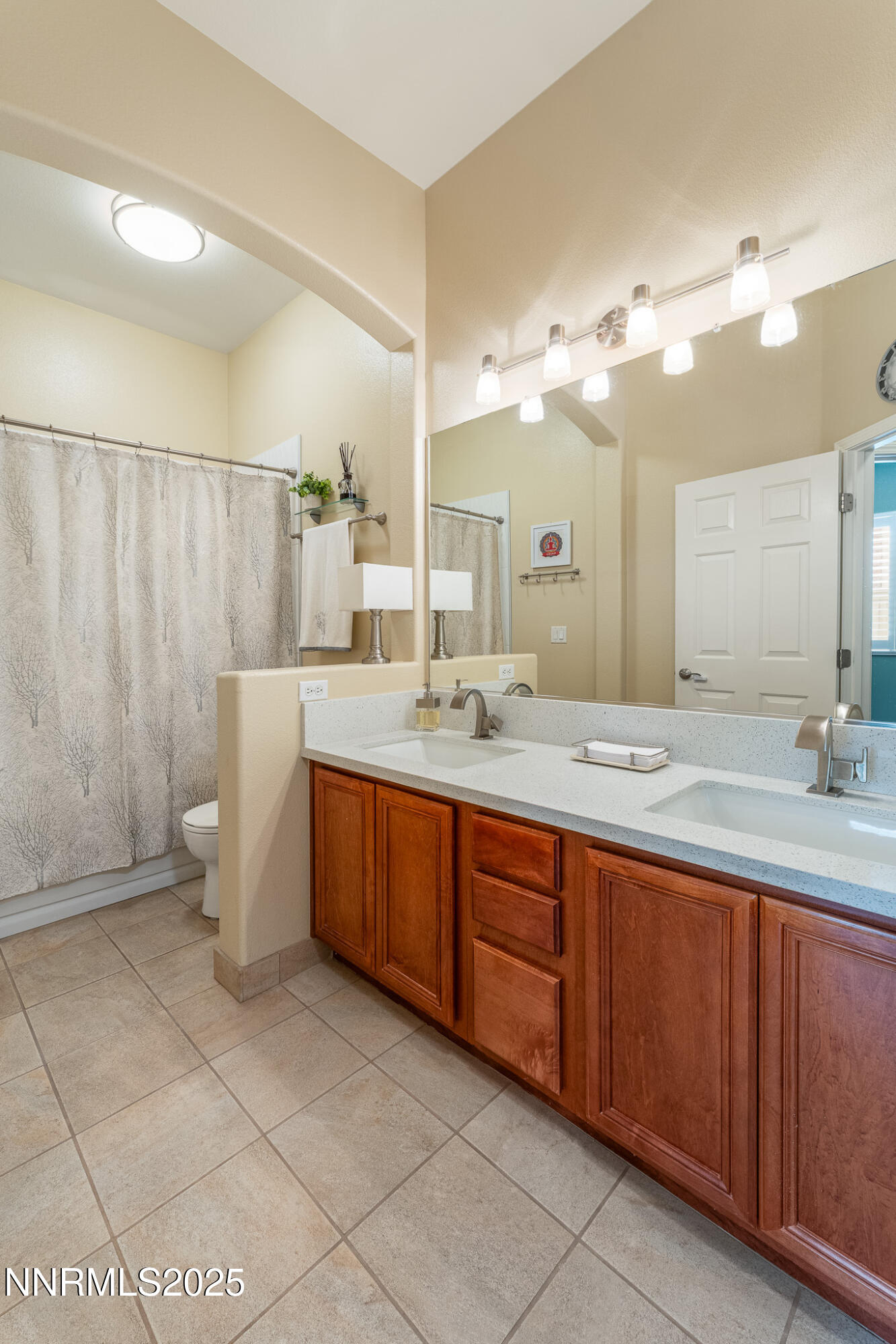 10600 Blue Moon Court Reno, NV 89521 - Photo 21 of 36 a bathroom with a double vanity sink mirror and