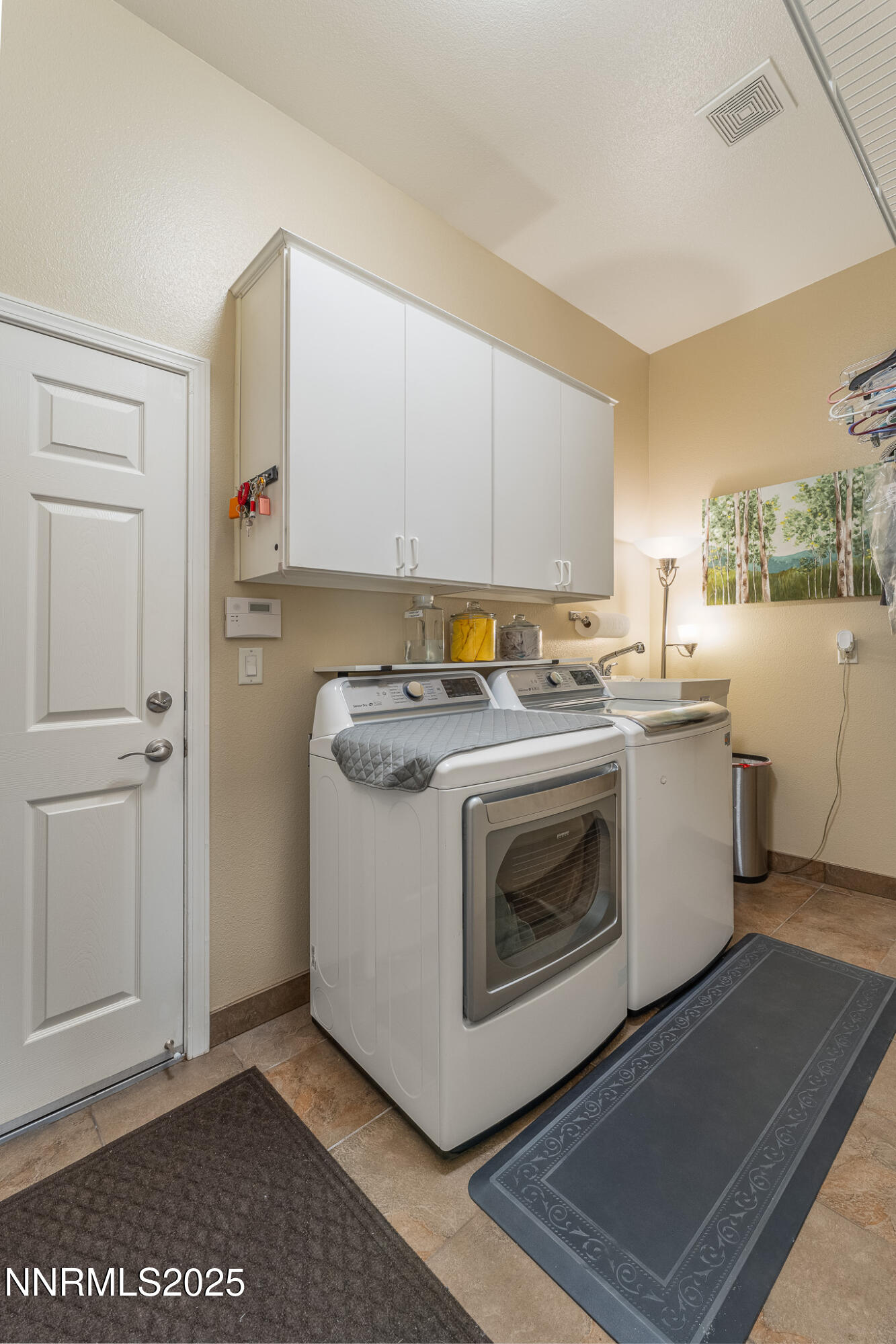 10600 Blue Moon Court Reno, NV 89521 - Photo 23 of 36 a utility room with washer and dryer