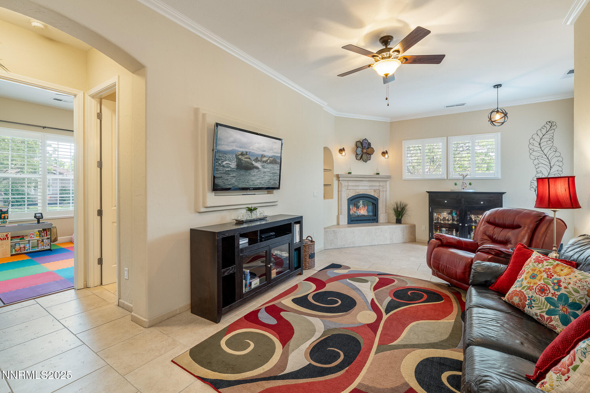 10600 Blue Moon Court Reno, NV 89521 - Photo 24 of 36 a living room with furniture and a flat screen tv