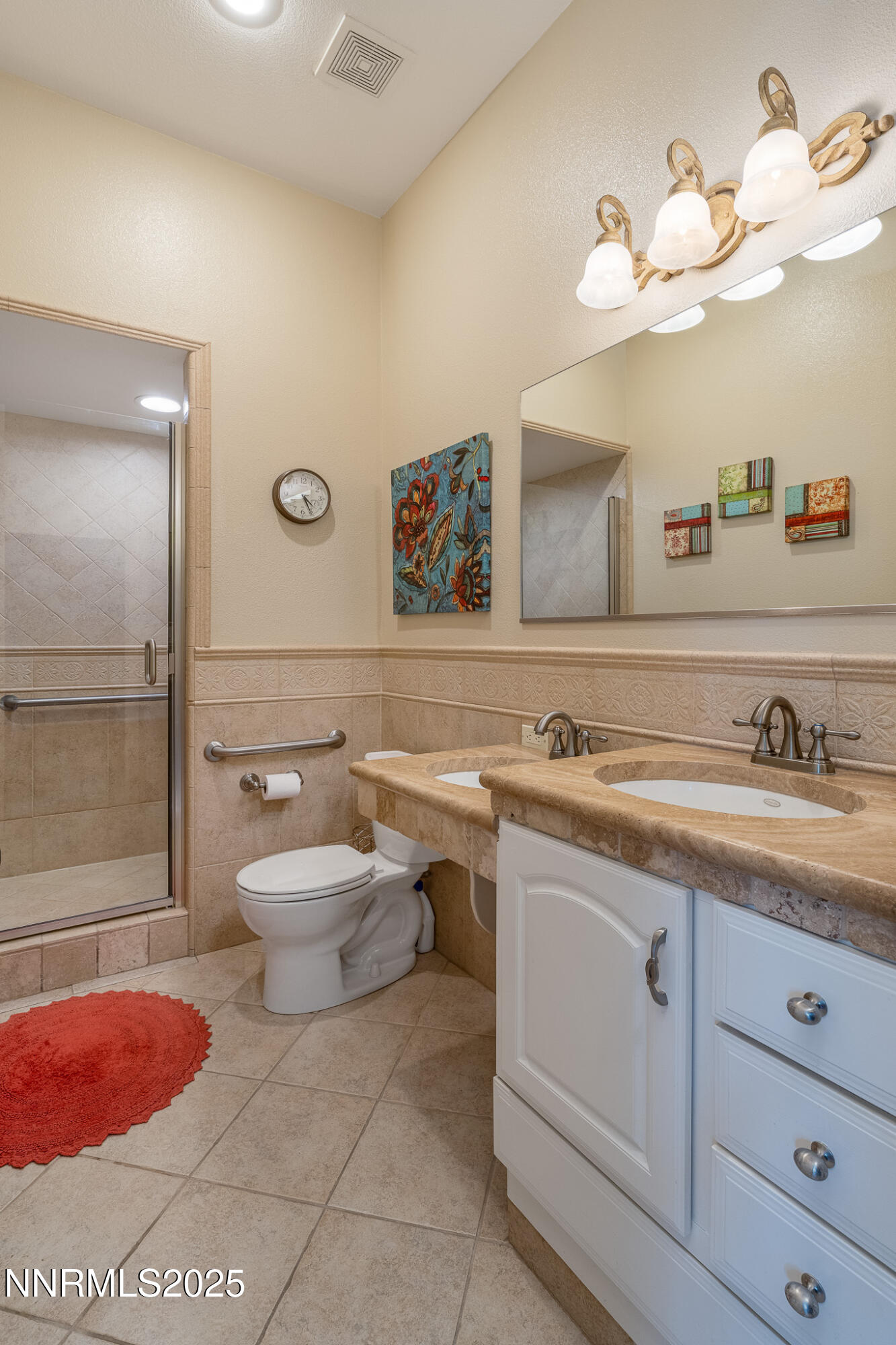 10600 Blue Moon Court Reno, NV 89521 - Photo 26 of 36 a spacious bathroom with a granite countertop sink mirror vanity and toilet