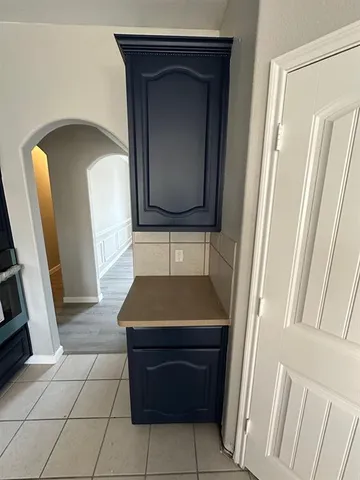 a room with a door and a mirror