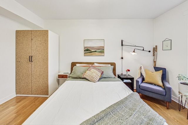 a bedroom with a bed and a couch