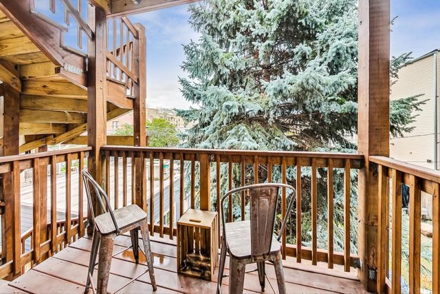a view of a balcony with chairs