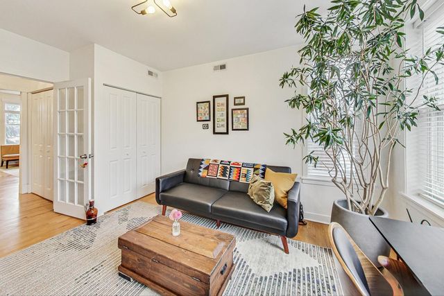 a living room with furniture and a rug