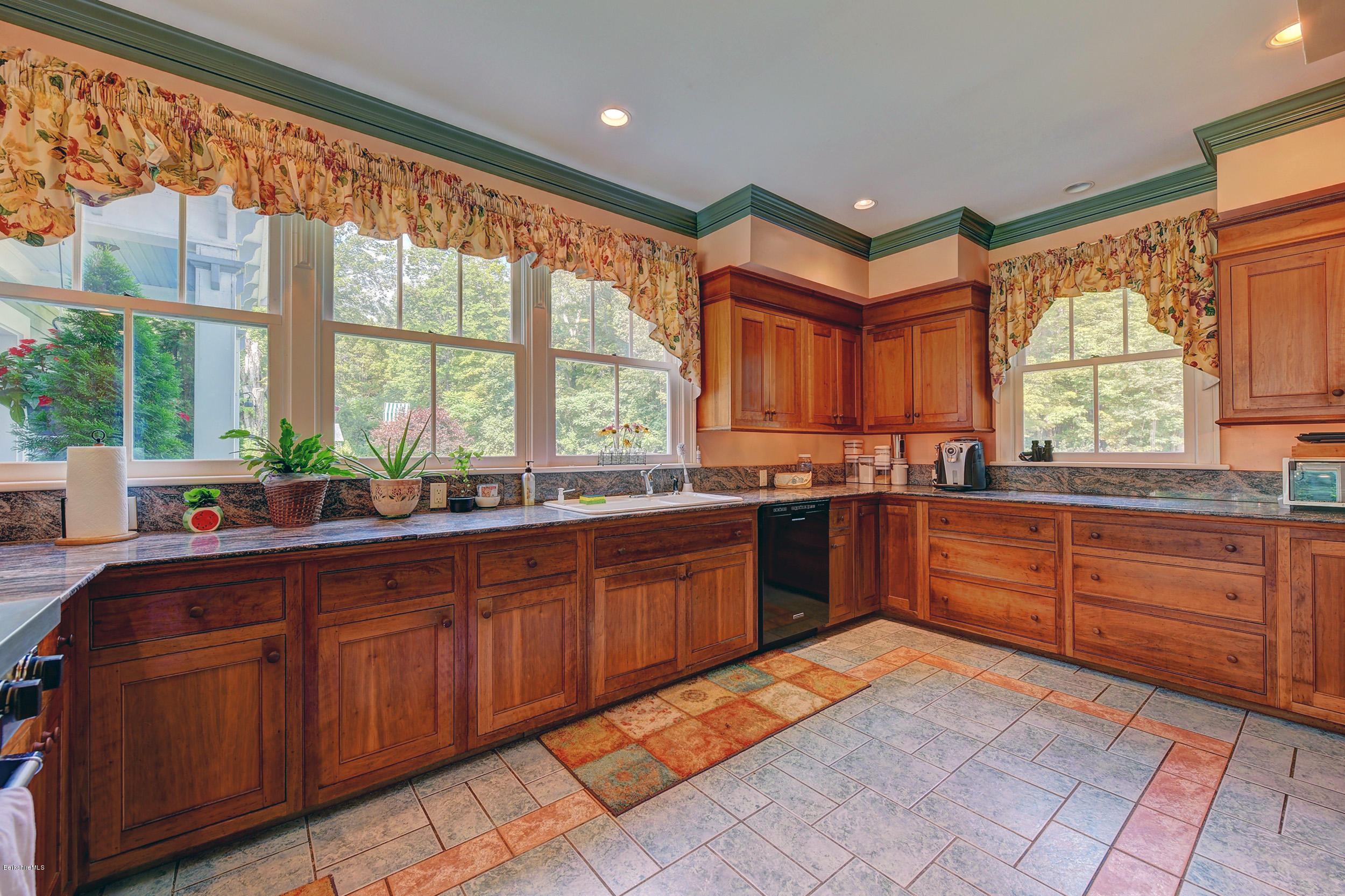 201 Rossiter Road Richmond, MA 01254 - Photo 11 of 52 a kitchen with stainless steel appliances granite countertop a stove a sink and a microwave