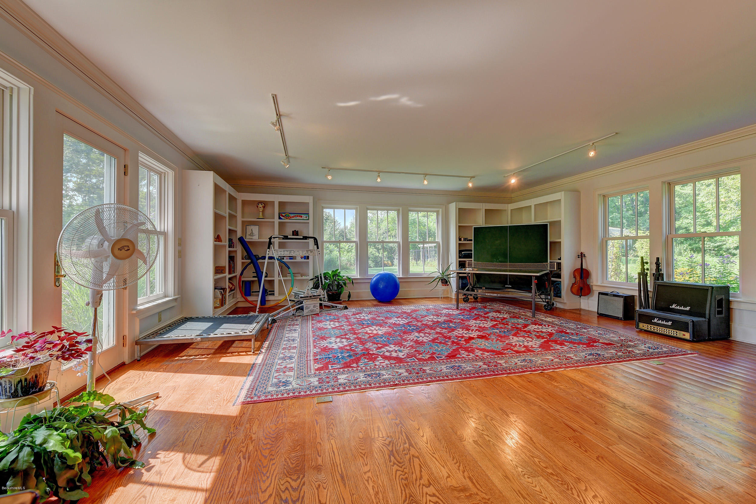 201 Rossiter Road Richmond, MA 01254 - Photo 20 of 52 a living room with furniture a flat screen tv and a large window