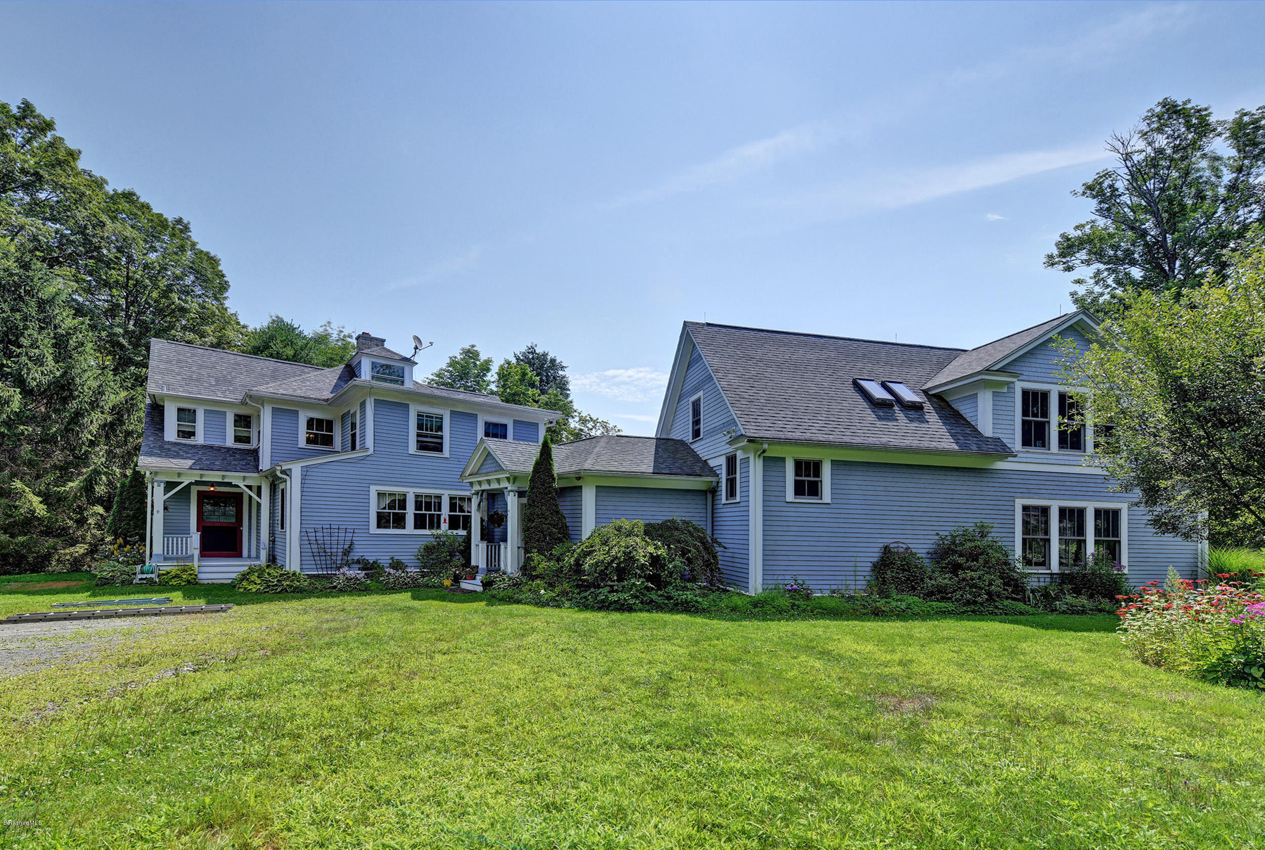 201 Rossiter Road Richmond, MA 01254 - Photo 3 of 52 a front view of a house with garden
