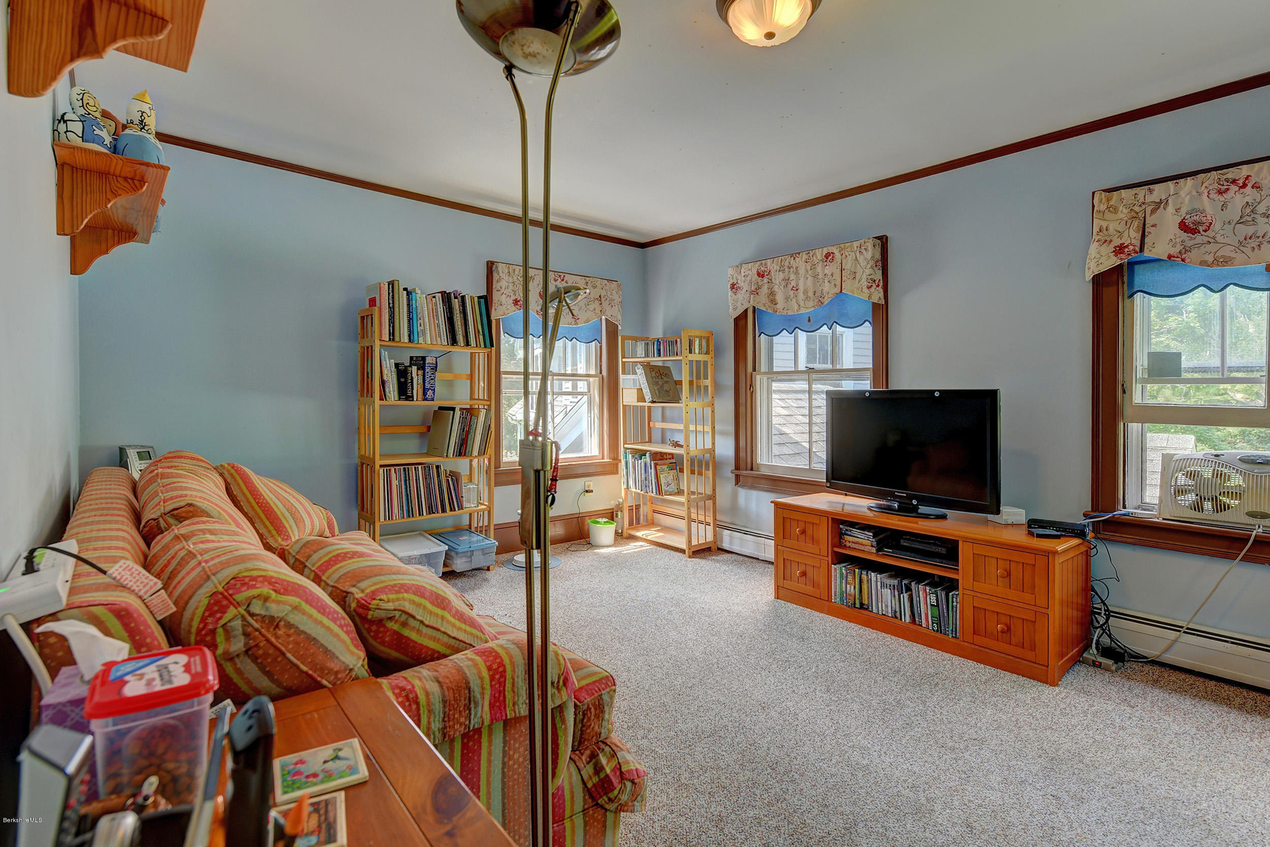 201 Rossiter Road Richmond, MA 01254 - Photo 26 of 52 a living room with furniture and a flat screen tv