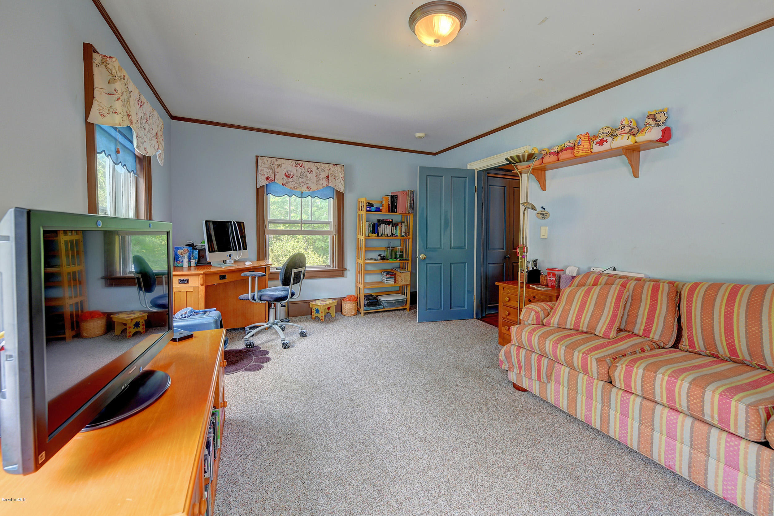 201 Rossiter Road Richmond, MA 01254 - Photo 27 of 52 a living room with furniture and a flat screen tv