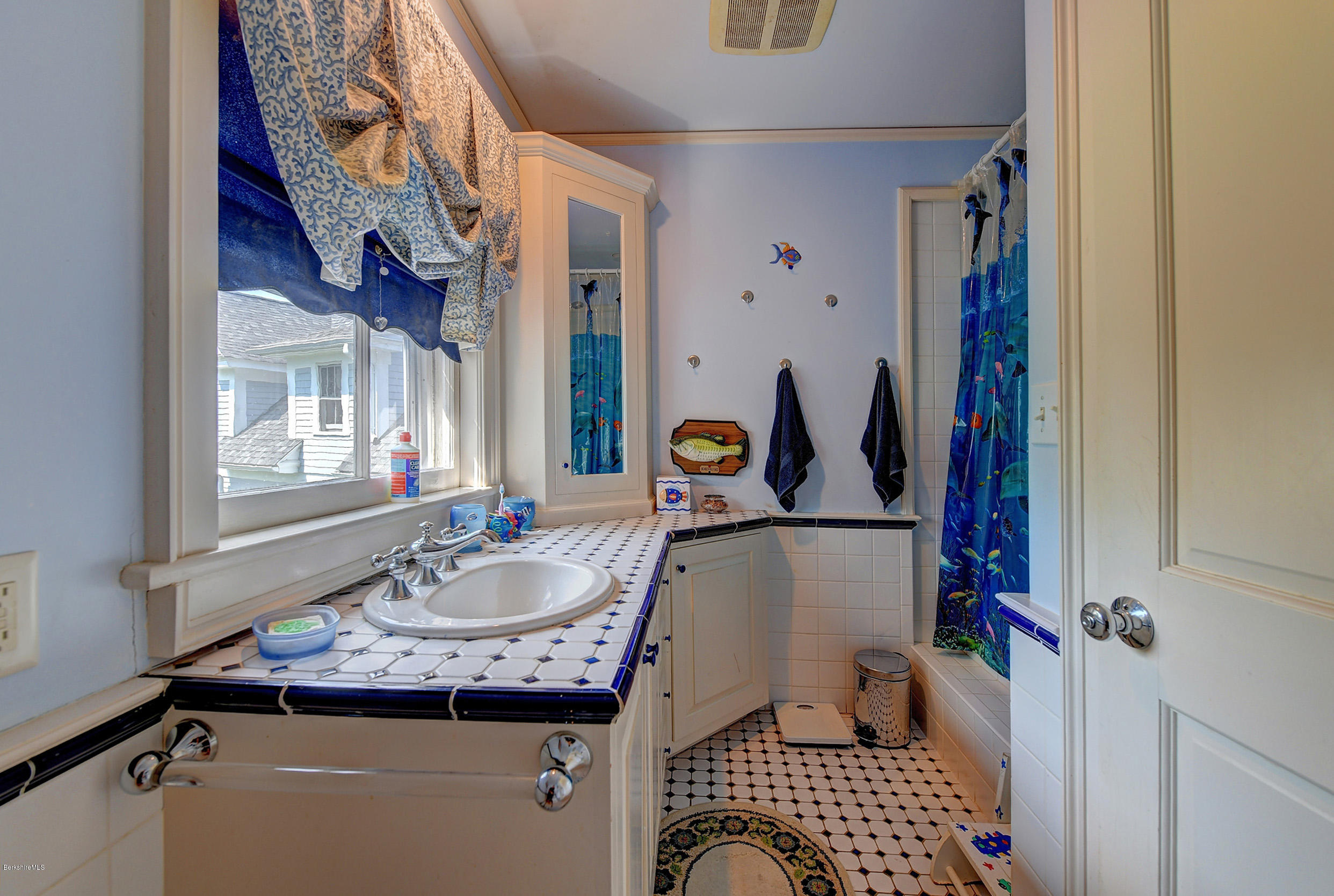 201 Rossiter Road Richmond, MA 01254 - Photo 31 of 52 a bathroom with a sink and mirror with bathtub