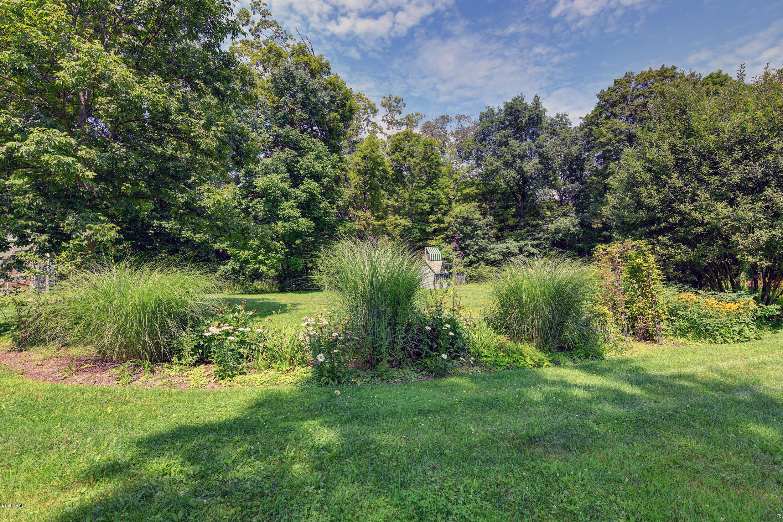 201 Rossiter Road Richmond, MA 01254 - Photo 45 of 52 a view of a garden with a lake