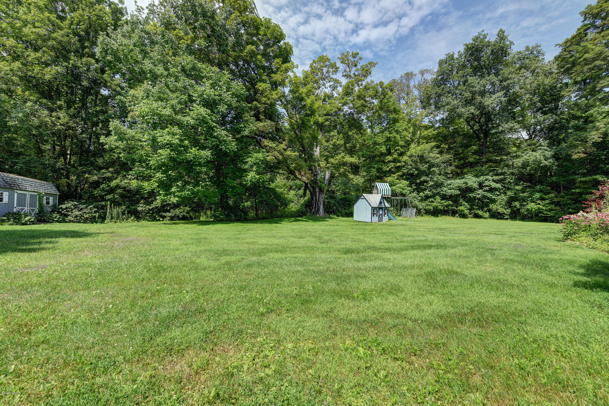 201 Rossiter Road Richmond, MA 01254 - Photo 46 of 52 a view of green field with trees in the background
