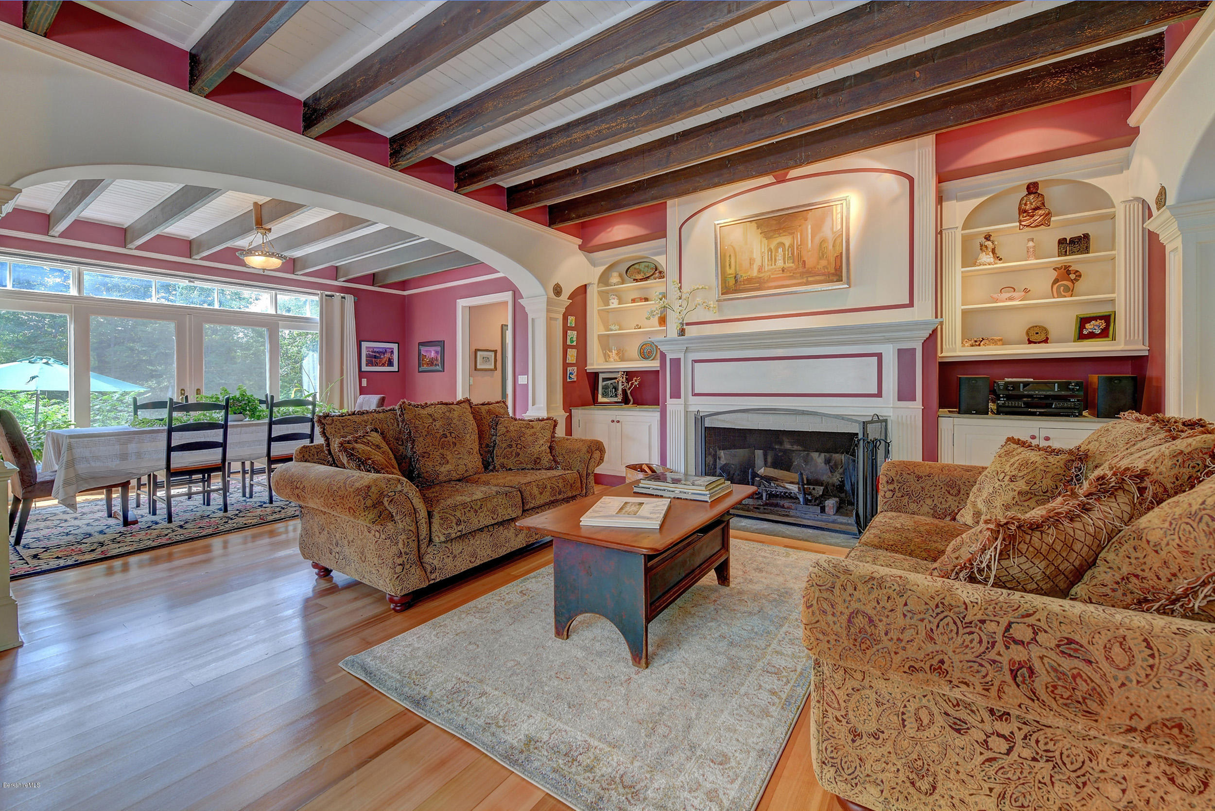 201 Rossiter Road Richmond, MA 01254 - Photo 7 of 52 a living room with furniture a wooden floor and a fireplace