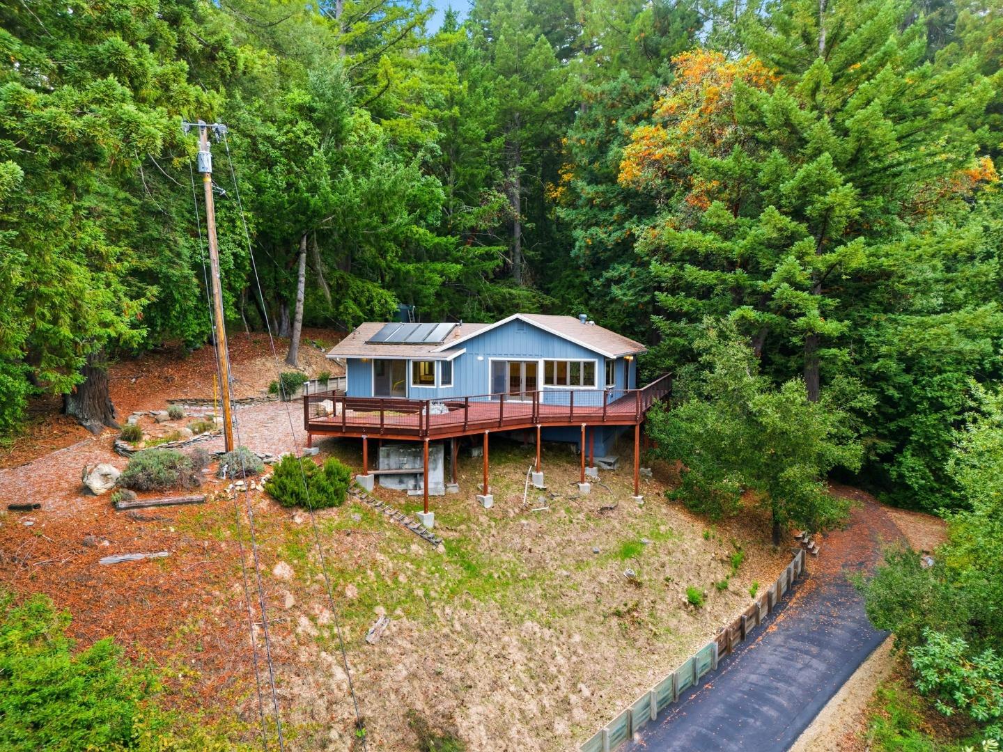 15245 Stetson Road Los Gatos, CA 95033 - Photo 15 of 60 a view of a house with wooden deck next to a lake