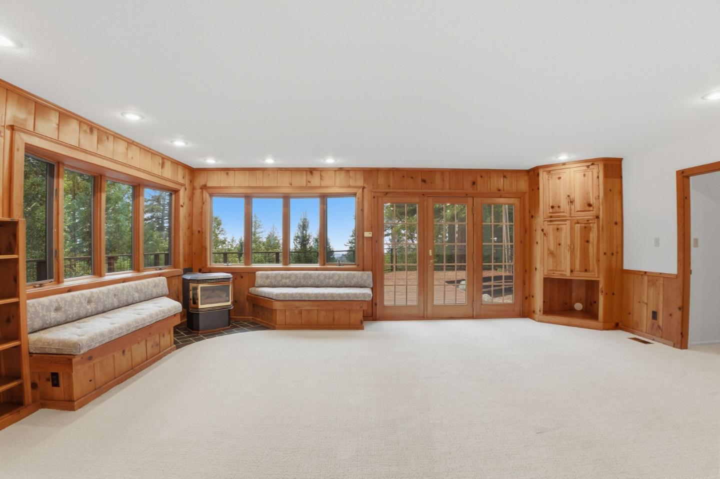 15245 Stetson Road Los Gatos, CA 95033 - Photo 17 of 60 a spacious bedroom with a large bed and a large window