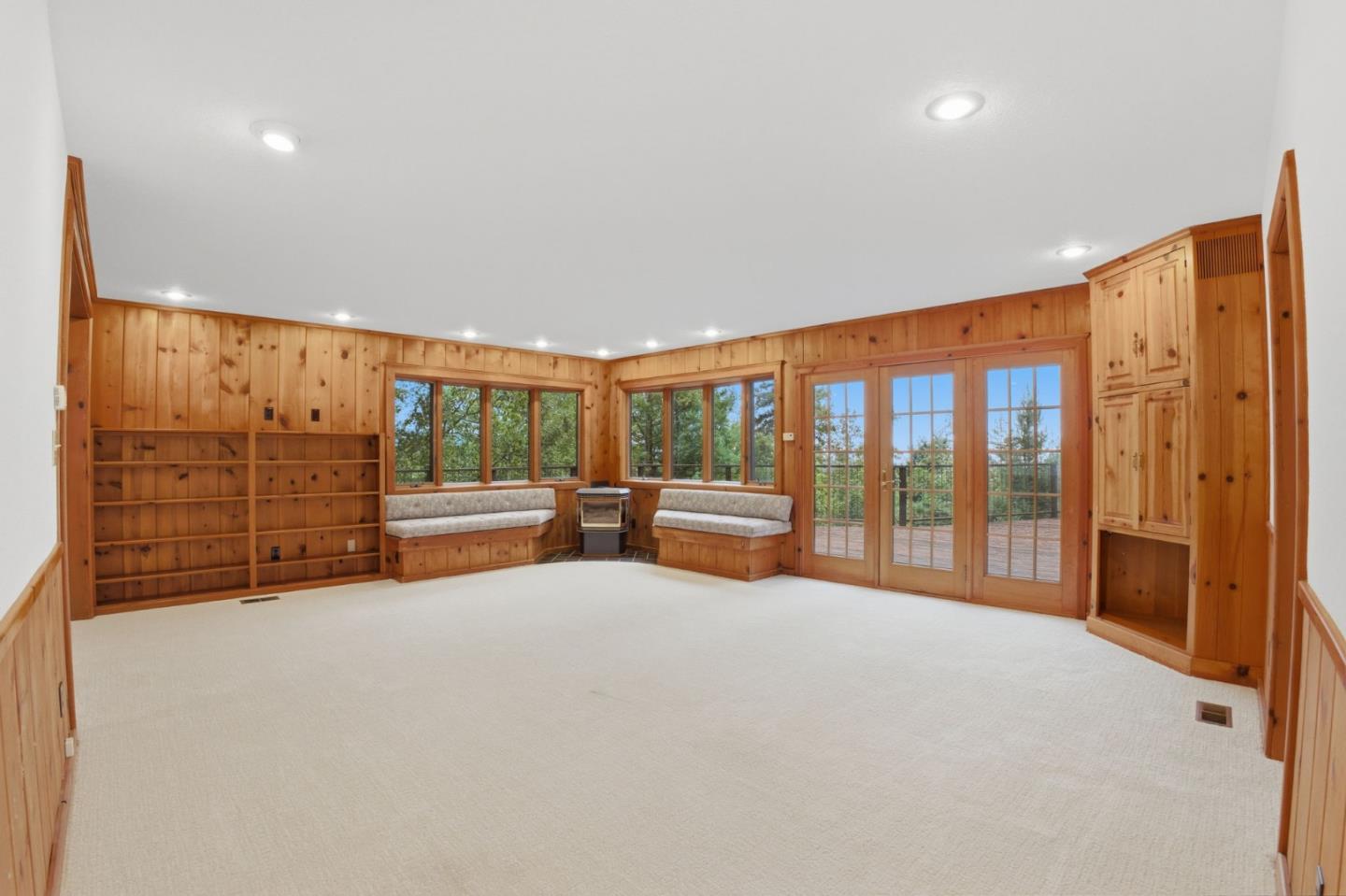 15245 Stetson Road Los Gatos, CA 95033 - Photo 18 of 60 a view of an empty room with furniture and a large window