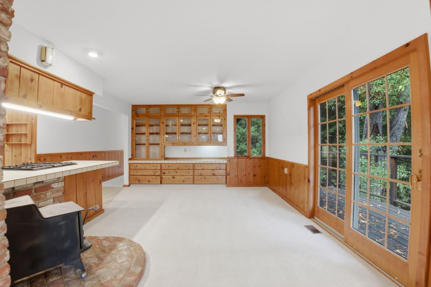15245 Stetson Road Los Gatos, CA 95033 - Photo 22 of 60 a view of a kitchen with kitchen island a large window and furniture