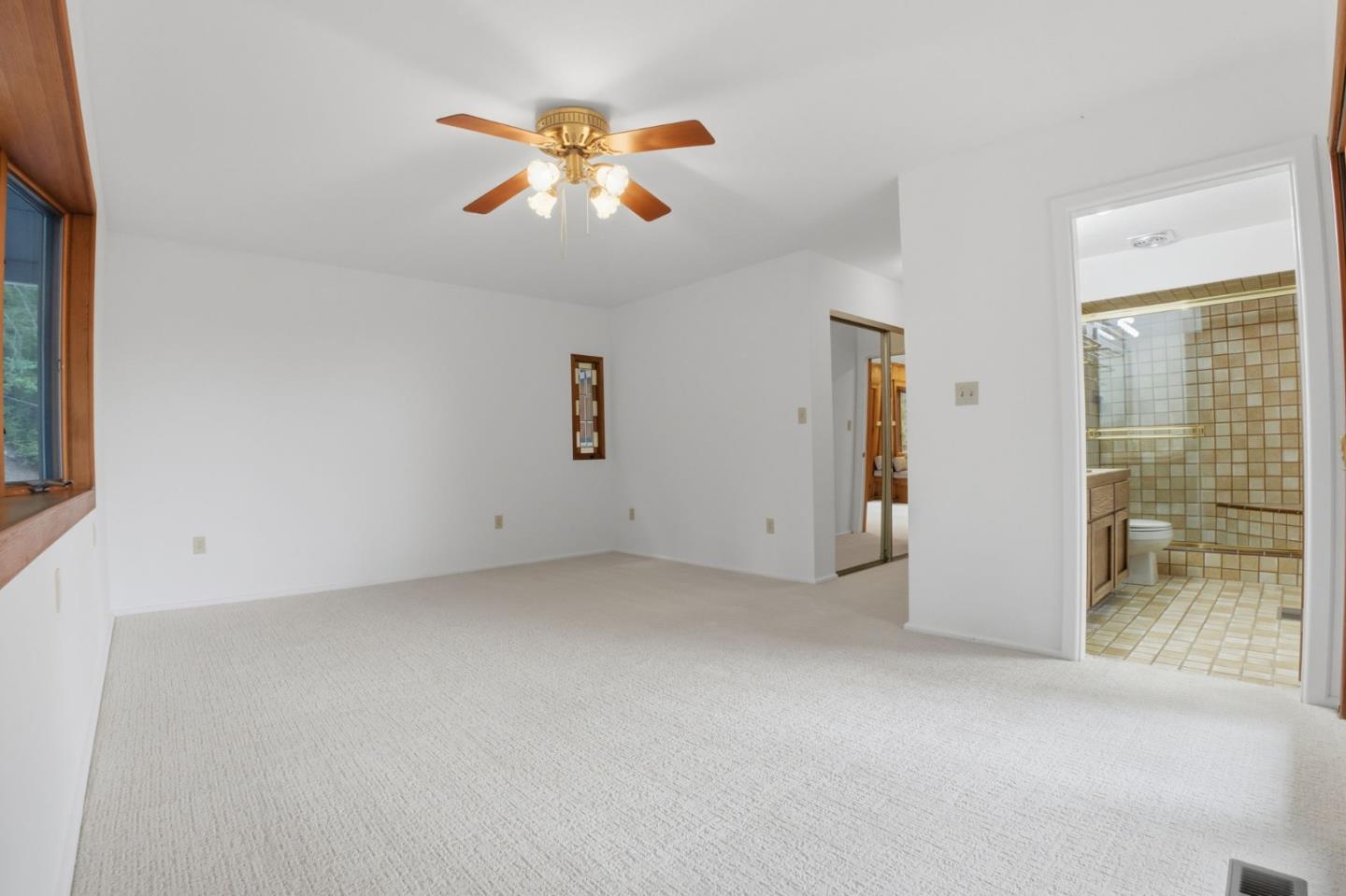 15245 Stetson Road Los Gatos, CA 95033 - Photo 47 of 60 an empty room with chandelier fan