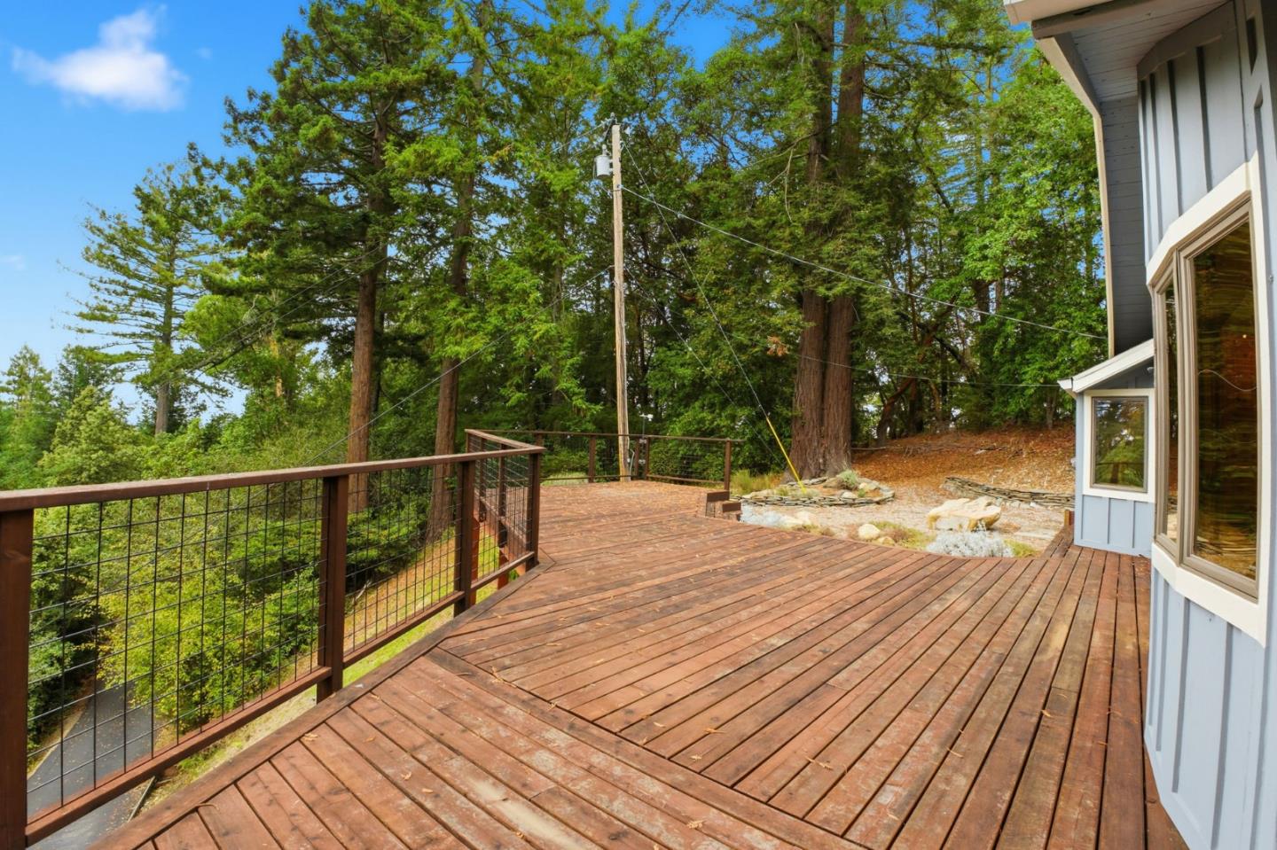 15245 Stetson Road Los Gatos, CA 95033 - Photo 51 of 60 a view of a balcony with wooden floor and fence