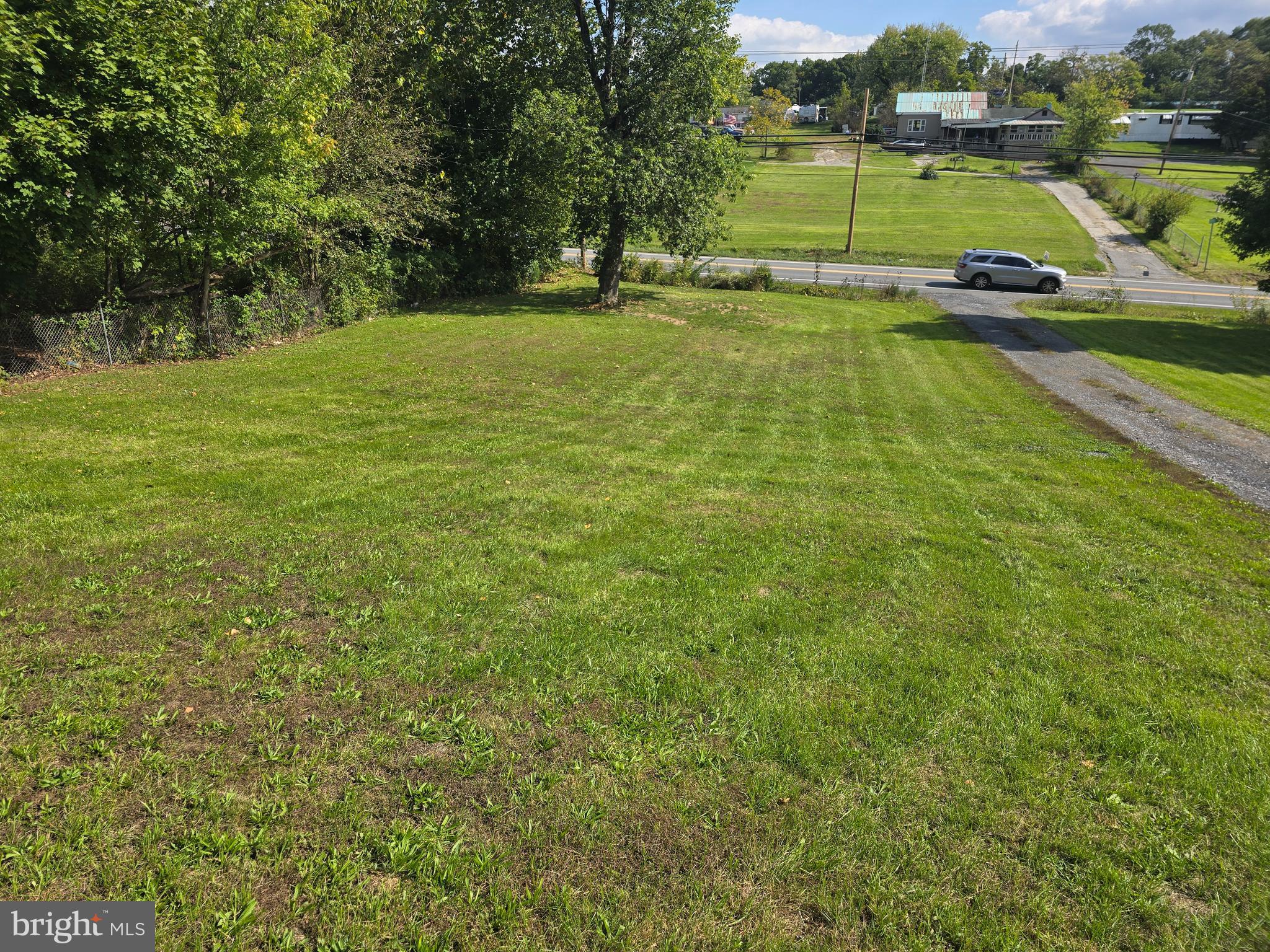 8005 Williamsport Pike, Unit 2 Falling Waters, WV 25419 - Photo 15 of 17 Spacious front yard