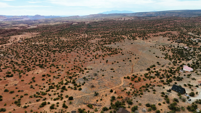 358 South Sky Drive Torrey, UT 84775 - Photo 72 of 82 Expansive desert landscape with scattered green scrub brush and distant red rock formations