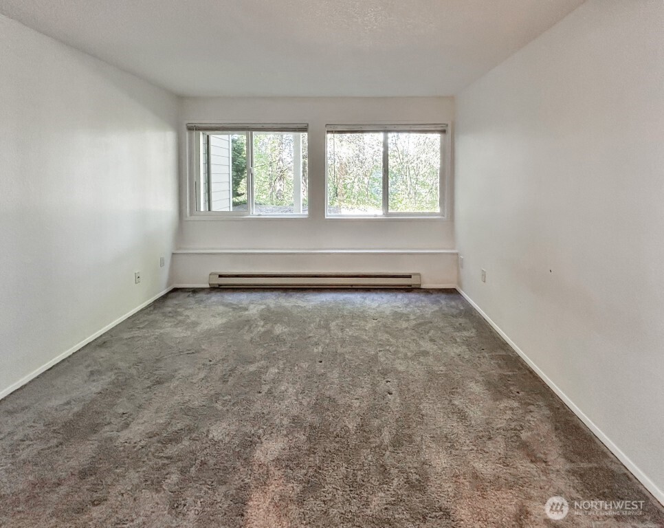 7571 Old Redmond Road, Unit 7 Redmond, WA 98052 - Photo 11 of 17 an empty room with a window