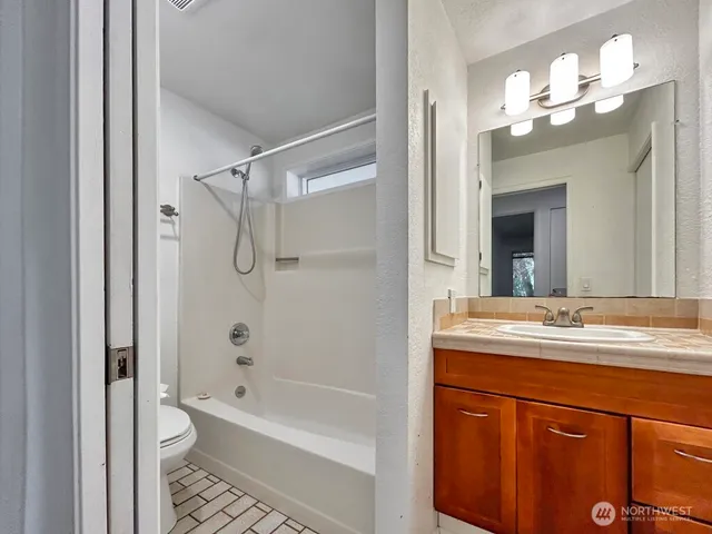 a view of a porch with a floor to ceiling window
