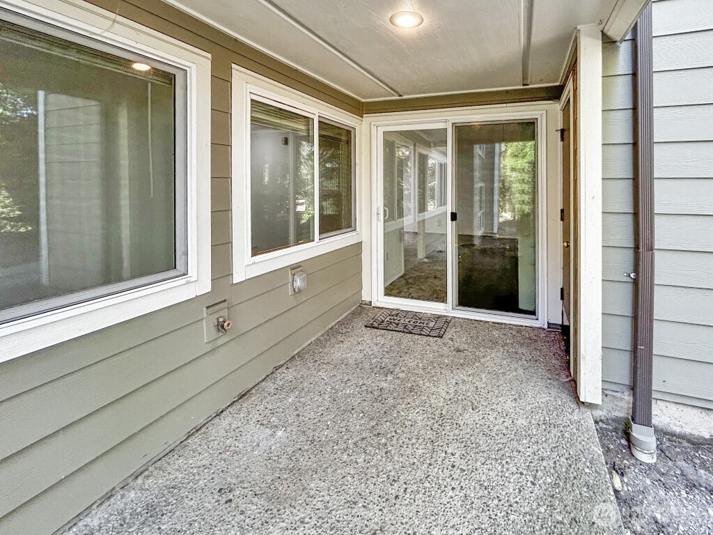 7571 Old Redmond Road, Unit 7 Redmond, WA 98052 - Photo 16 of 17 a view of a porch with a floor to ceiling window