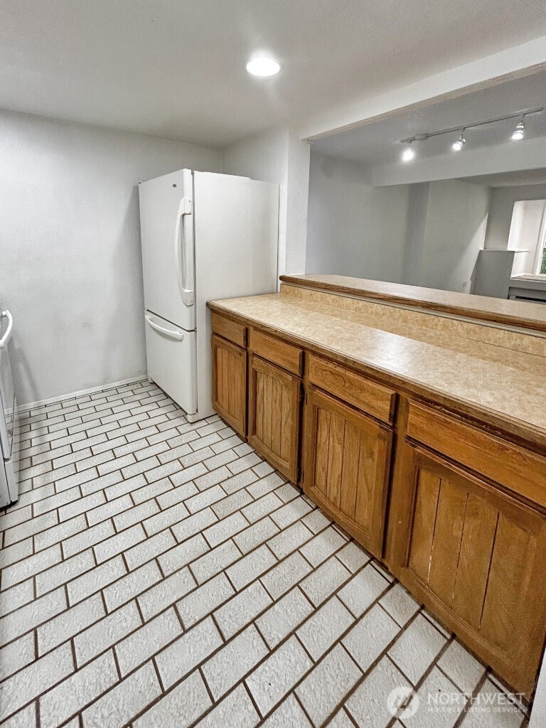7571 Old Redmond Road, Unit 7 Redmond, WA 98052 - Photo 3 of 17 a bathroom with a sink a toilet and a mirror