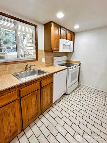 a kitchen with a sink and cabinets