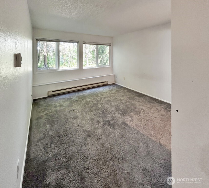 7571 Old Redmond Road, Unit 7 Redmond, WA 98052 - Photo 10 of 17 an empty room with a window