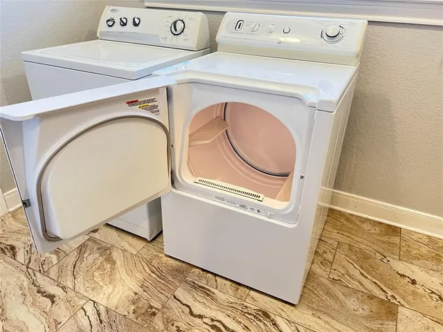 a utility room with dryer and washer