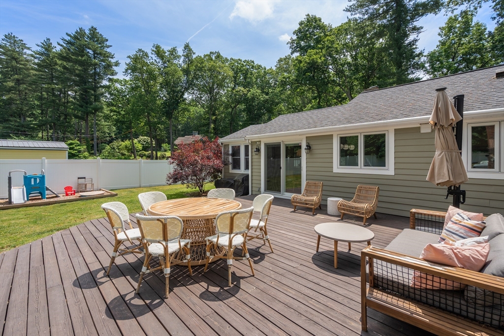 57 Marlboro Road Sudbury, MA 01776 - Photo 31 of 40 a view of a patio with a table and chairs