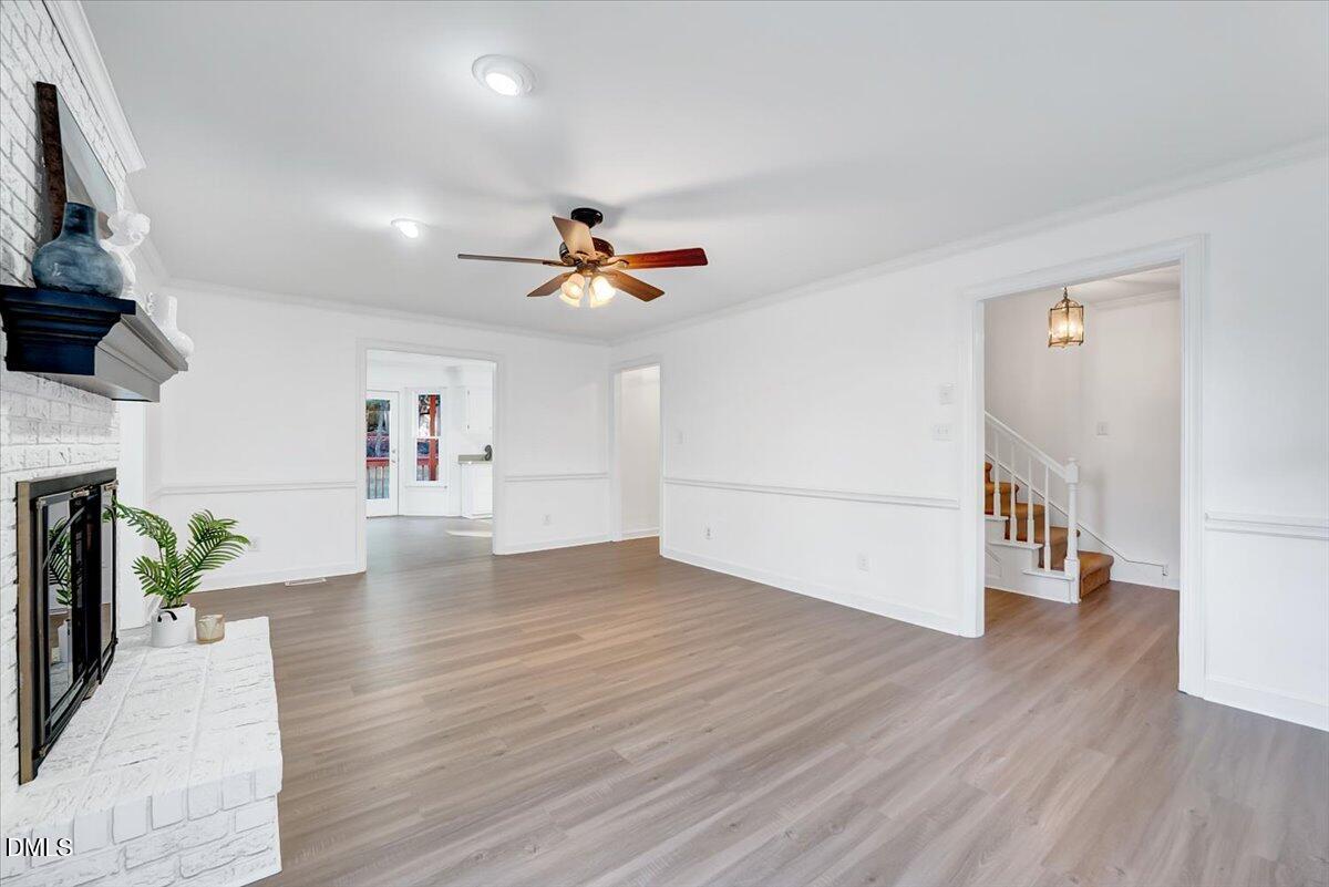 1208 Turner Farms Road Garner, NC 27529 - Photo 10 of 38 a view of empty room with wooden floor and fan