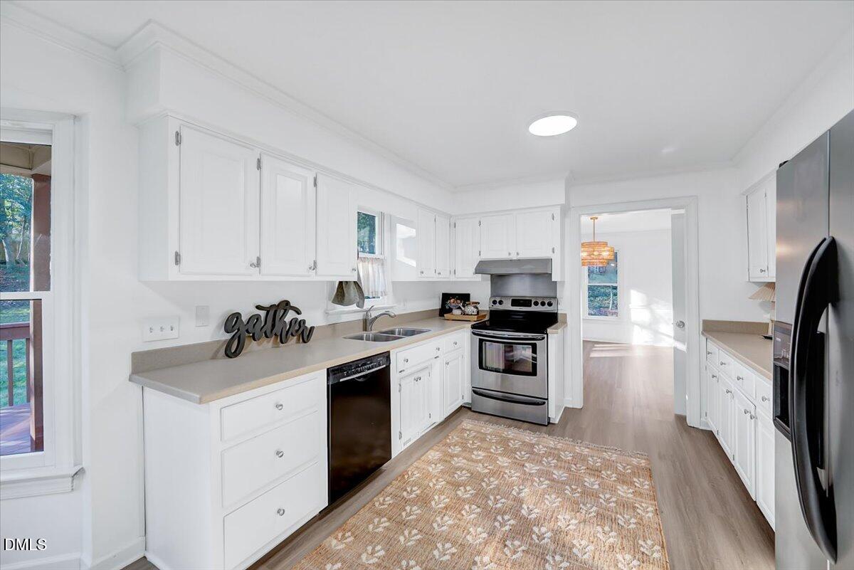 1208 Turner Farms Road Garner, NC 27529 - Photo 15 of 38 a kitchen with a sink stove and refrigerator